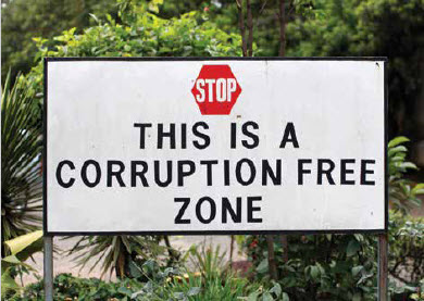 A stop sign with text under it that says This is a Corruption Free Zone