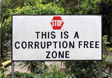 A stop sign with text under it that says This is a Corruption Free Zone